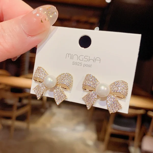 Micro inlaid bowtie earrings - Image 1