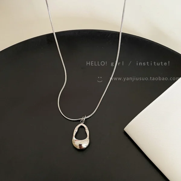 Silver hollow water droplet pendant necklace for women - Image 5