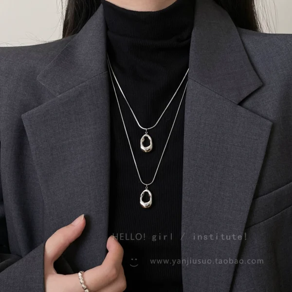Silver hollow water droplet pendant necklace for women - Image 2