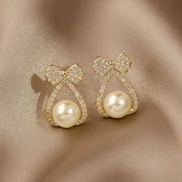 Butterfly knot pearl earrings - Image 1