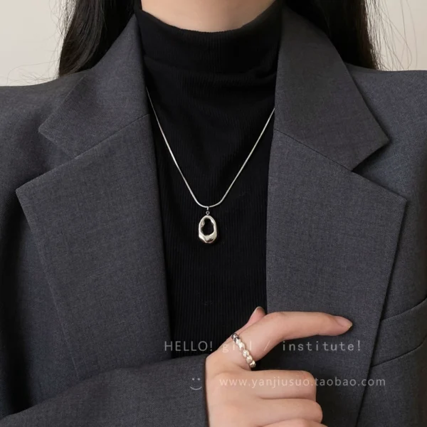 Silver hollow water droplet pendant necklace for women - Image 1