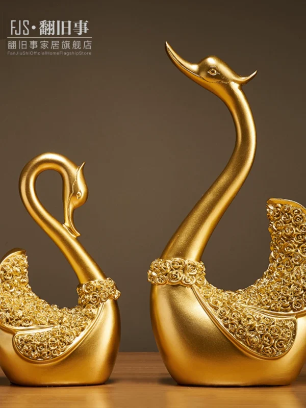 A pair of swan ornaments at the entrance of the living room - Image 1