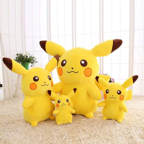 Pillow compared to Pikachu plush toy - Image 1